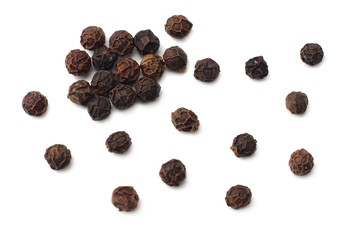 Black peppercorn isolated on white background. top view