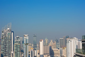 Fototapeta na wymiar Bangkok, Thailand – December 21, 2019 : Office Buildings, city and condominiums Area in Bangkok, Office Building in City, Modern Building, Businesses Building. Sky view from Asoke area. with blue sky.