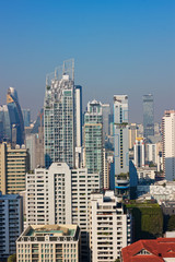 Naklejka premium Bangkok, Thailand – December 21, 2019 : Office Buildings, city and condominiums Area in Bangkok, Office Building in City, Modern Building, Businesses Building. Sky view from Asoke area. with blue sky.