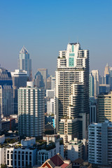 Fototapeta na wymiar Bangkok, Thailand – December 21, 2019 : Office Buildings, city and condominiums Area in Bangkok, Office Building in City, Modern Building, Businesses Building. Sky view from Asoke area. with blue sky.
