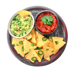 Plate with tasty nachos and sauces on white background