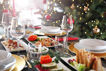 Fototapeta na wymiar Christmas table. Traditional and tasty Christmas dishes. Christmas dishes, festive table setting. Horizontal composition.