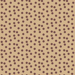 Scattered polka dots beige coffee color seamless pattern