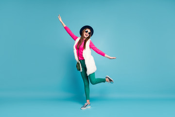 Fototapeta na wymiar Full length body size view of her she nice attractive lovely funky positive cheerful cheery girl dancing having fun fooling isolated on bright vivid shine vibrant green blue turquoise color background