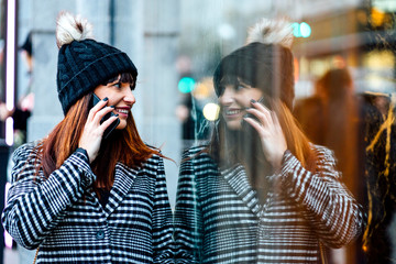 attractive woman smiling using smart phone