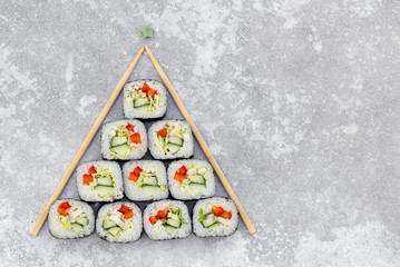 sushi christmas tree on grey background