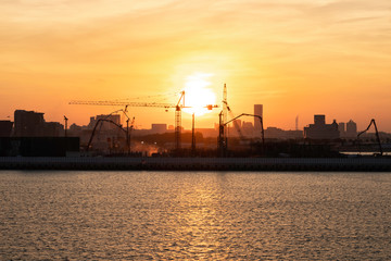 Fototapeta na wymiar Industrial sunset in the harbour.
