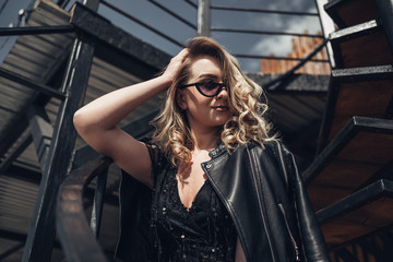 Portrait of Stylish Young Woman in Black Leather Jacket