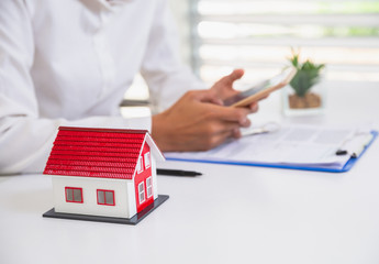 women using calculator to count rent, Calculating mortgage, loan or investment.Buying and selling houses and real estate prices concept.