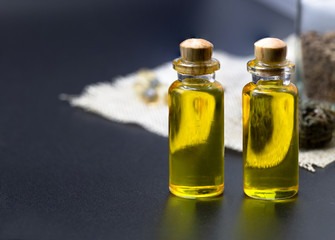 CBD oil hemp products. CBD oil cannabis extract On a black background, Medical cannabis concept.