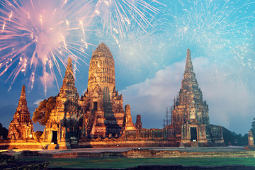 Beautiful Buddhist temple at night with fireworks for celebrations.