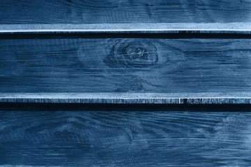 Wood texture. Background of classic blue wooden boards. Color of the year 2020.