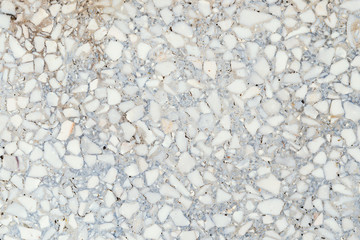 Texture of gray cracked tiny stone floor for background.