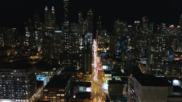 Aerial - Push Left to Reveal City Skyline with Traffic Lights Below