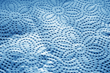 Paper towel surface with blur effect in navy blue tone.