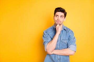 Photo of pensive interested man looking into empty space contemplating new creative ideas touching...