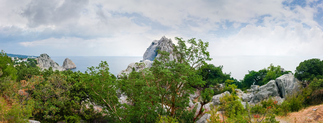 Panoramic view of sea coast with steep rocks