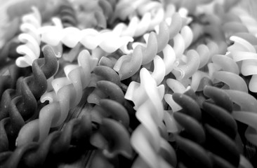 Fototapeta premium Dry pasta close-up with blur effect in black and white.