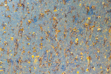 Rusty metal wall with cracked paint, background texture
