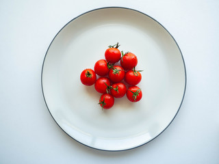 Red tomatoes Put on dish White,Food for healthy,white background