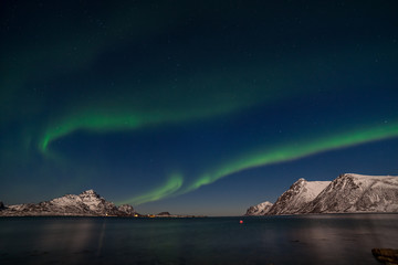 amazing aurora borealis, northern lights, over mountains in the North of Europe - Lofoten islands, Norway