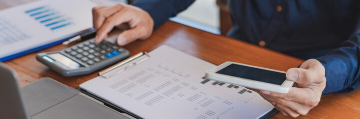 Close-up of male hands typing on keyboard Working On Compute Sitting Table And Office Tools At Workplace, writing emails, communicating online concept.