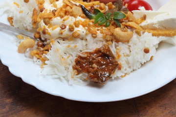 Alu Pyad Chanachur with rice and mango pickles. Rice with vegetables