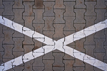 Painted x mark on a pavement 