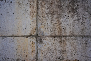 Closeup shot of a cement, stone wall, pavement