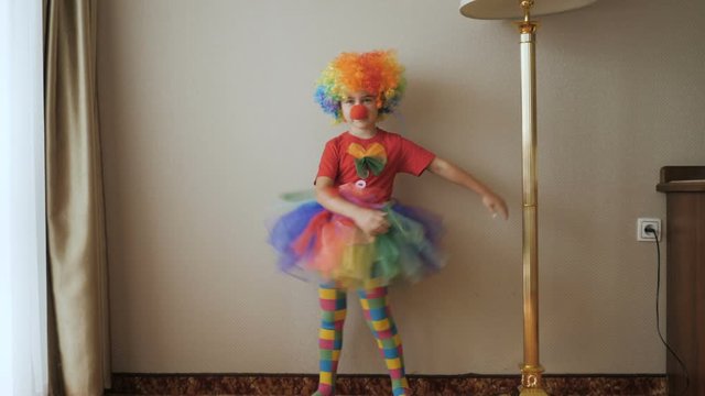 Happy Clown Little Girl Dancing And Have Fun In the Room. Little Child Clown Enjoying Dance, Having Fun Together, Party. Floss Dance Viral, Flossing.