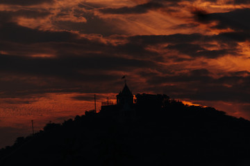 Clouds above temple of the hill during sunset