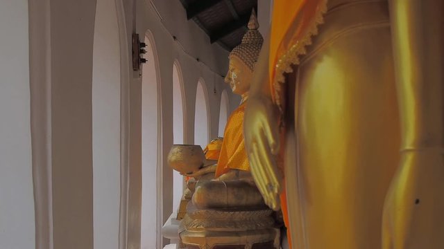 Vdo. view of seated buddha statue holding a bowl, Wat Phra Pathom Chedi, Nakhon Pathom, Thailand.