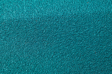 Background of rough paint with a texture of green and emerald