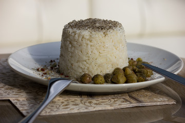 Cooking. White basmati rice on a white plate. 