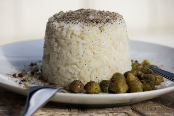 Cooking. White basmati rice on a white plate. 