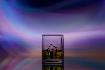 Fototapeta na wymiar glass alcohol drink in spotlight