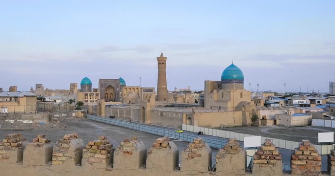 Cityscape of Bukhara on sunset with Po-i-Kalan architectural complex and Kalyan minaret, Uzbekistan