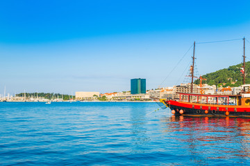 Fototapeta na wymiar Skyline of Split, Croatia, largest city in the region of Dalmatia and popular touristic destination, ships in harbour and 