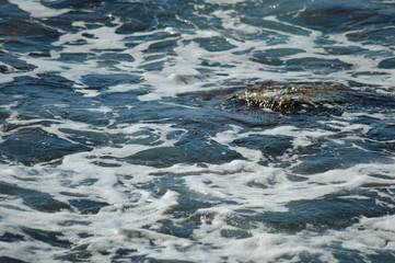 Photograph of seawater surface. Water texture.