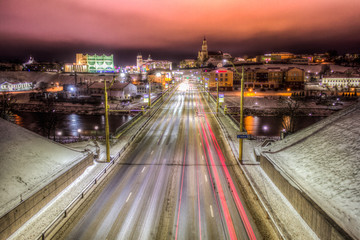 Fototapeta na wymiar BELARUS, Grodno, January 3, 2019: Night Grodno, road with cars, bridge with cars at night.