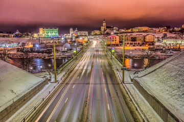 Fototapeta na wymiar BELARUS, Grodno, January 3, 2019: Night Grodno, road with cars, bridge with cars at night.