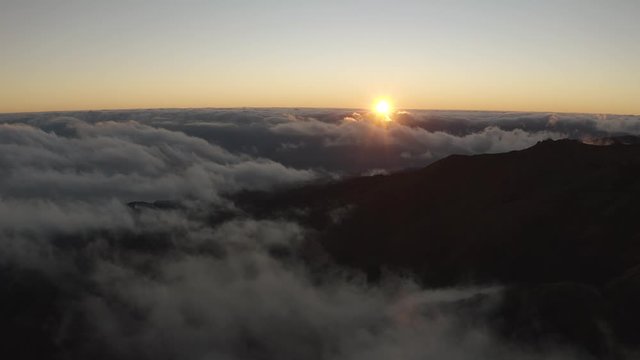 Flying over the hill during epic sunset. Cinematic scene. Travel concept. 