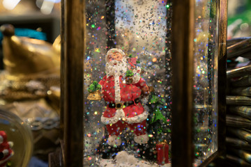 Santa Claus with snowflakes. Toy Christmas present. New Year's atmosphere of celebration and fun