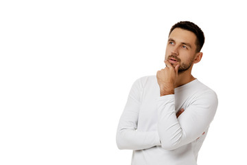 portrait of doubtful bearded man in casual white shirt asking questions isolated on white...