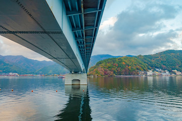 Japan. Kawaguchiko Lake. Bridge across the lake Kawaguchiko bottom view. Bridge in the city Fujikawaguchiko. Hotels on the shores of Lake Japan. Five Fuji Lakes. Japan Nature. Fujikawaguchiko Tourism