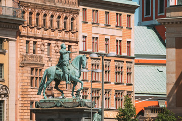 Fototapeta na wymiar Stockholm, Sweden. Statue Of Former Swedish King Karl XIV Johan Sitting On A Horse Royal Palace. Famous Popular Destination Scenic Place. Close Up