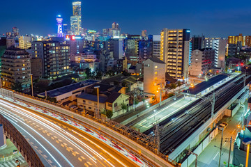 Japan. Osaka. Panorama of Osaka in the evening. Houses and highways in Osaka. Transport system of the Japanese city. Cities of Japan. Skyscrapers in the business center of the city.