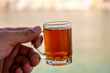 A cup of tea in the hand