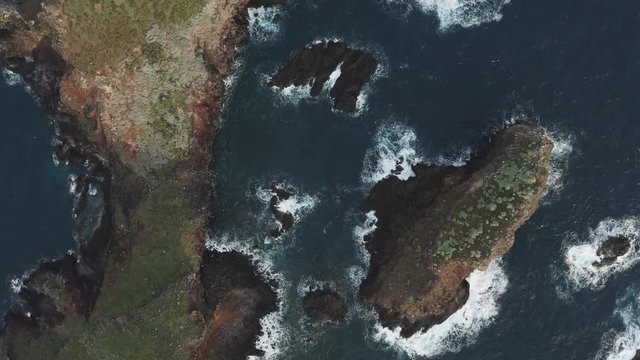 Flying over the dramatic coastline with birds. Beautiful cinematic scene. 