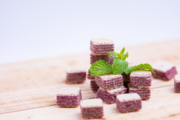 Mint and Candy wafer placed on a wooden table.